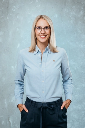 Woman in a blue blouse against a blue background
